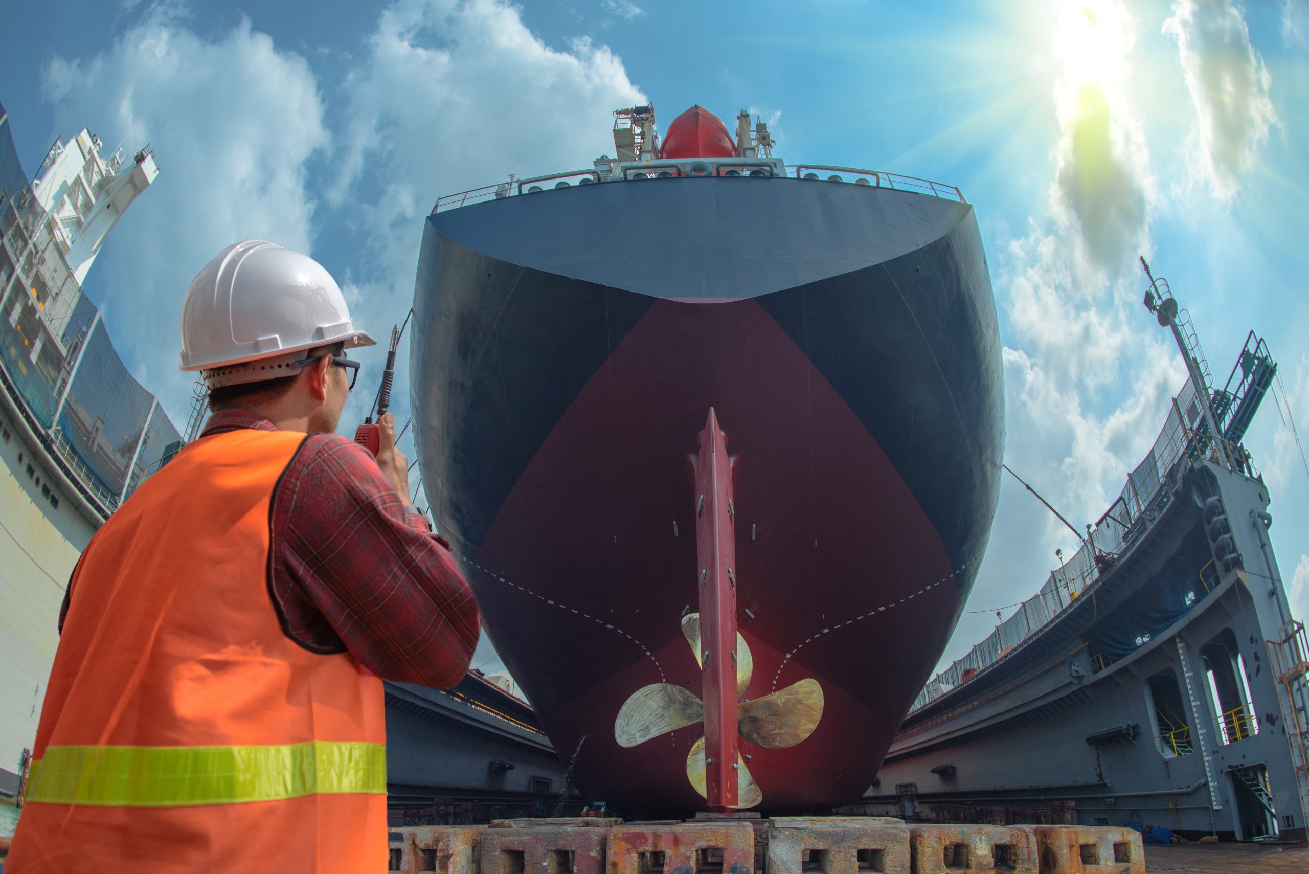 supervisor, foreman, inspector, surveyor takes final inspection of the cleaning, repairing, recondition of over hull of the commercial ship in dry dock yard, ready to delivery the ship to the sea supervisor, foreman, inspector, surveyor takes final inspection of the cleaning, repairing, recondition of over hull of the commercial ship in dry dock yard, ready to delivery the ship to the sea
