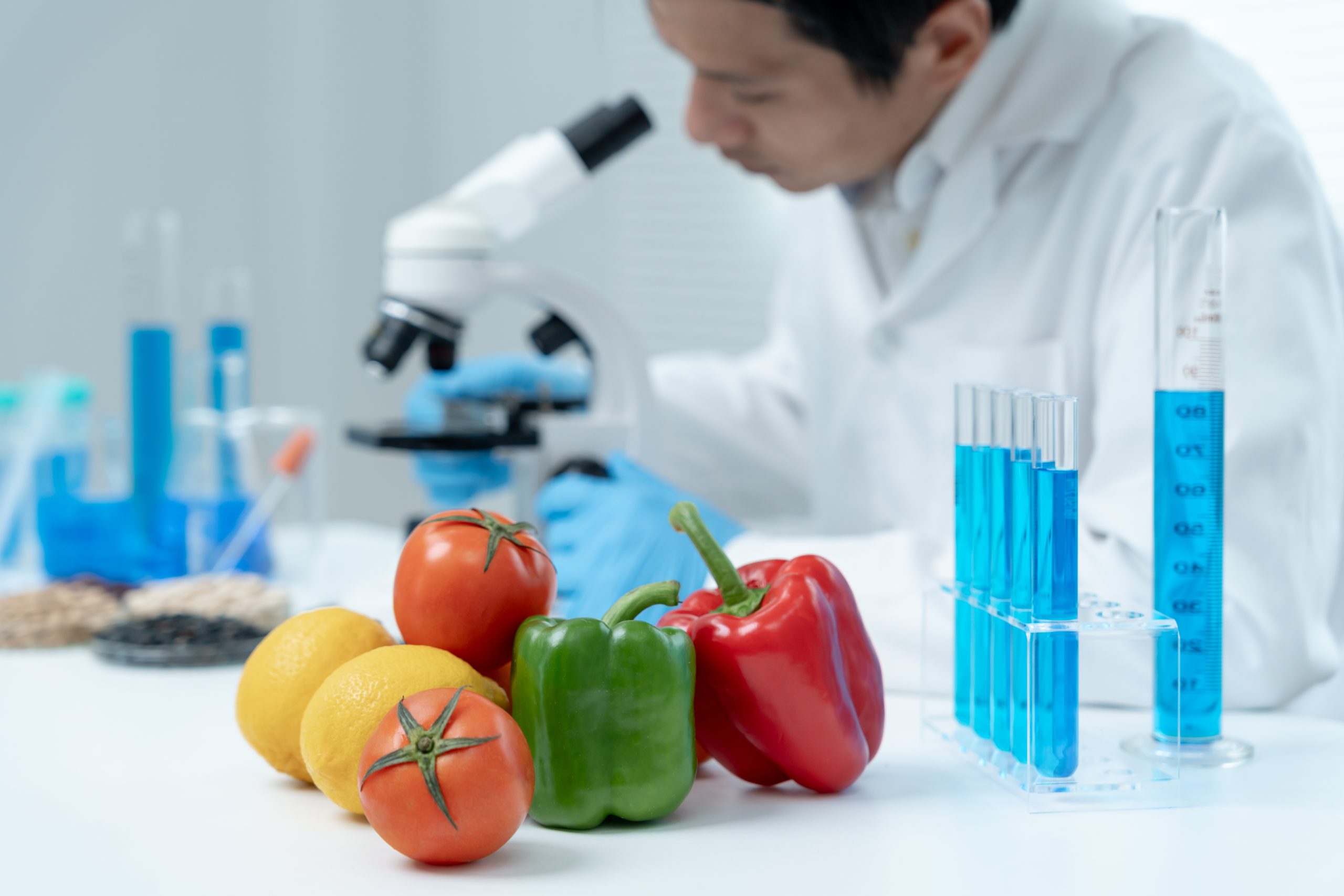 Scientist check chemical food residues in laboratory. Control experts inspect quality of fruits, vegetables. lab, hazards, ROHs, find prohibited substances, contaminate, Microscope, Microbiologist Scientist check chemical food residues in laboratory. Control experts inspect quality of fruits, vegetables. lab, hazards, ROHs, find prohibited substances, contaminate, Microscope, Microbiologist